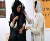 an instructor teaches a trainee how to secure an automotive seat belt at the saudi aramco driving school for women at the headquarters of the saudi arabian oil co in dhahran saudi arabia on tuesday june 12 2018 xxx add second sentence xxx.jpg from saudia arab xxx