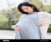 happy pregnant chinese woman gekttx.jpg from chinese preg