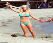 jenny mccarthy 4.jpg from malibu ca actress jenny mccarthy and her long time boyfriend actor jim carrey spend the 4th of july with jennys son evan in their malibu home the couple looked happier than ever stealing kisses in between talking jenny spent great deal of time playing on the beach with evan building sandcastles and playing in the sand while jim watched on from their porch jim carrey was sporting peppered beard making him look older than usual which he didnt seem to mind gsi media july 2009 2a0cbkm jpg