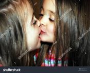 stock photo two beautiful sisters kissing and looking at each other 4423111.jpg from sister stare