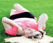 woman pink lying grass football field subject beautiful women 86190354.jpg from pink lying