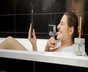 woman relaxing soothing bath having video call her tablet computer best to promote idea digital detoxing 285652815.jpg from awesome looking bath video self recorded for her bf