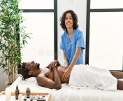 young physiotherapist woman giving abdominal massage to african american man clinic 238657117.jpg from ladies massage for man