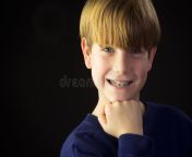 young boy shows off his green braces reveals proud smile 32633048.jpg from prepuberty