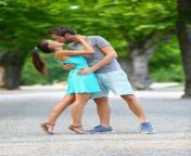 young couple lovers love kissing summer park first kiss passionately standing path full body portrait caucasian 51846788.jpg from lovers smooching in park