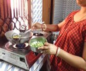 indian beautiful village women cooking vegetable her kitchen mixed gas stove tripura kumarghat 178194293.jpg from desi village woman cooking in naked sareeimal sex petlust man