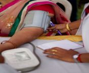 nurse check bp blood pressure indian woman patient medical camp electronic meter hyderabad india 147108942.jpg from indan bo