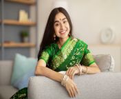 portrait cheerful indian lady beautiful green sari dress sitting sofa smiling camera indoors lovely young woman 217892658.jpg from indian in green saree dress fuck