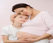 pregnant mother tenderly embracing her son 13032100.jpg from mom and son pregnan