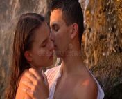 romance under waterfall rocks sunset slow motion young guy girl going to kiss shooting 98106135.jpg from mp4 romance couple romance