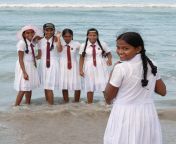 schoolgirls uniform playing beach 23008558.jpg from sri lankan sexy school