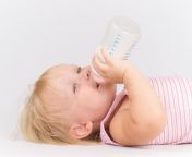 adorable baby eating milk bottle 20305018.jpg from milk eating