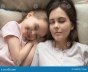 young mom sleeping relaxing bed cute little daughter top view close up calm lying smiling preschooler peaceful 164680935.jpg from www xxx mom sleep littil san reapdian telugu school sex mms desindian enjoyed with small