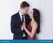 young people bedroom kissing hugging dress code red dress navy blue suit sexy elegant couple kissing bedroom 106970062.jpg from hot bedroom red dress kiss