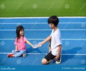 young boy give bottle water to girl selective focus asian plastic blue track running 197335221.jpg from www anty is giving water