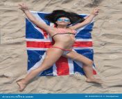 girl bikini lying union flag smiling brunette sand beach view above 34209912.jpg from in bikiniunylion naket