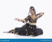 indian young lady performing traditional dance called mujra wearing black anarkali dress authentic jewelry 137670494.jpg from indian mujra mp