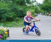 little boy riding bike ride park summer 121657340.jpg from pak with small biy