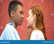 mixed race boyfriend tenderly holding girlfriends chin moment first kiss stock photo 161865722.jpg from chin bf