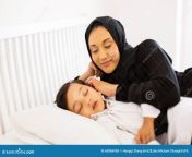 muslim mother son sleeping beautiful watching her bed 63086938.jpg from doha sex mom sleeping son xxx