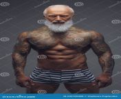 naked grandfather muscular tattooed body gray portrait shirtless muscular old man fashionable hairstyle against 242705980.jpg from naked grandfather