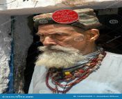 old pakistani man hat red badge peshawar pakistan wearing beaded necklaces portrait direct sunlight black beard 164049580.jpg from pakistani old men and yung ledi fuking v