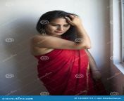 portrait young attractive indian bengali brunette woman traditional red sari standing seductive way front glass window 165980710.jpg from horny young indian antora bengali fingering ass showing mp4