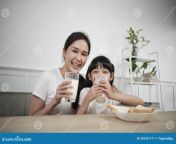 portrait healthy asian thai family happy daughter young mother looking camera drink fresh milk bread together 255761171.jpg from saxy japanese mom drink milk breast for 5 to 15
