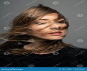 portrait serious serbian adult woman her hair covering her face against gray wall portrait serious serbian 234439062.jpg from serbian mature