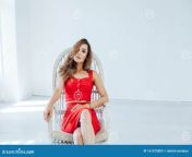 portrait business woman red dress sits white chair beautiful fashion 161575003.jpg from sexi chair video