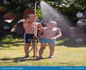 shower outdoor children under garden hot day 66801947.jpg from 10 old showering together