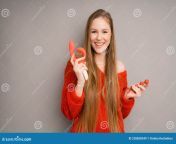 attractive italian girl depicts emotion happiness smiling holding red dildo vaginal balls her hand 228858349.jpg from cute italian symbian and dildo play