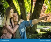 boyfriend girlfriend standing showing romantic love countryside green luscious field embracing each other cuddling 92154329.jpg from boyfriend girlfriend standing fun in classroom