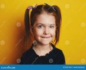funny adorable kid girl showing first milk tooth change teeth concept cute little ponytails isolated over blue background 223513567.jpg from a cute changing and showing