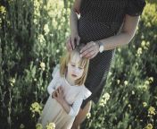 portrait of little girl standing with her mother in rape field psif00020.jpg from rapeing a little
