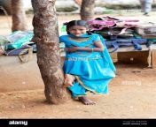 rural indian village school girl standing by a tree in an outside dhm3w5.jpg from indian desi village schools outdoor
