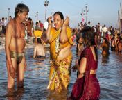 0069 india allahabad maha kumbh mela couple bath sangam ganges worship water saree 2013.jpg from kumbh mela aunty nude