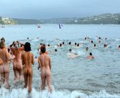 the first wave of swimmers hits the water at cobblers beach by peter hancock.jpg from nude swim