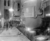 steel workers gaze on as molten steel is poured from ladle to casts at homestead steel works december 31 1914 pd.jpg2000x1616 q85 crop subsampling 2 upscale.jpg from converting young vir