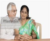 630 03479594em senior man sitting with his arm around a mature woman stock photo.jpg from indian old uncle and aunty sex