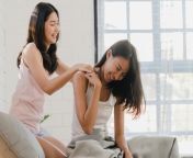 asian lesbian lgbtq women couple massage each other home 7861 1820.jpg from lesbian massage rooms