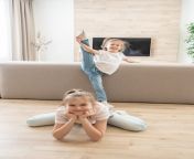 two girls doing stretching exercises in living room at home friendly sisters concept 130111 3710.jpg from Гимнастика дома сестрёнки