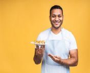 young african american indian black man eating sushi using chopsticks isolated yellow background cook preparing sushi 255757 8996 jpgsize626extjpg from black cook indian