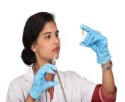 female doctor with stethoscope is holding injection syringe 136354 7264.jpg from indian doctor give injection saree nav
