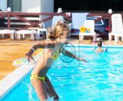 crianca feliz brincando na agua azul da piscina menina aprendendo a nadar conceito de ferias de verao menina linda nadando na agua da piscina crianca salpicando e se divertindo na piscina 400 107674699.jpg from júlia veloso piscina