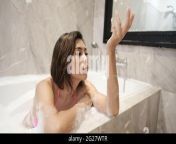 fun in the tub non nude young lady blowing bubbles in a tub of bubble bath 2g27wtr.jpg from young non nud