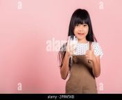 asian little kid 10 years old smile hold milk glass drink white milk and show thumb up finger for good sign 2prw5kb.jpg from 10 yars gals milk