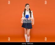 child with present box boxing day school market shopping smart and intelligent kid at orange wall back to school childhood of small girl student study school girl in uniform knowledge gift waf3g6.jpg from más school student girl www xvidios com