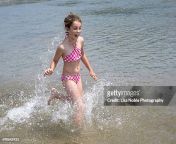 girl in pink swim suit splashing in water jpgs612x612wgik20cqrw4ordnxjhu1sfdmxxefuacc16a5sdmwgrka3x13jg from pekbook 16