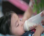 asian chinese grandmother feeding cute baby boy at home with milk bottle jpgs640x640k20cx4zhmymyd5obzauhfk2ikqe2oedmi0g0l9vuyiljrj0 from new mom china milk videoa